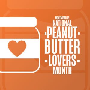 An orange graphic with a peanut butter jar featuring a heart, alongside bold white text that reads: November is National Peanut Butter Lovers Month.