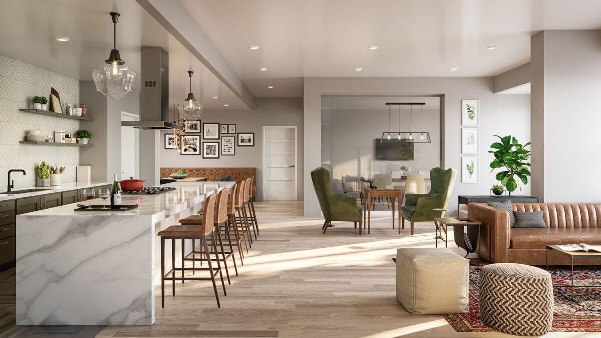 Open-concept living space featuring a modern kitchen with island seating, a dining area, and a living room with a sofa, armchairs, and plants under natural light.